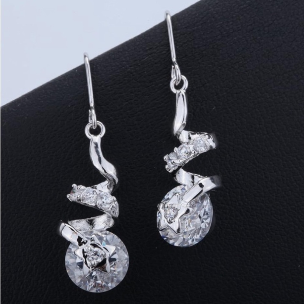 Cubic Zirconia faceted bridal pierced silver tone twisted design drop earrings